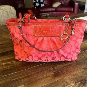 Coral coach purse. Excellent condition.